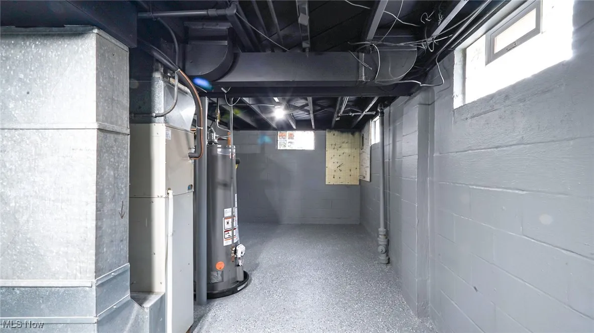 Below grade area with gas water heater and heating unit