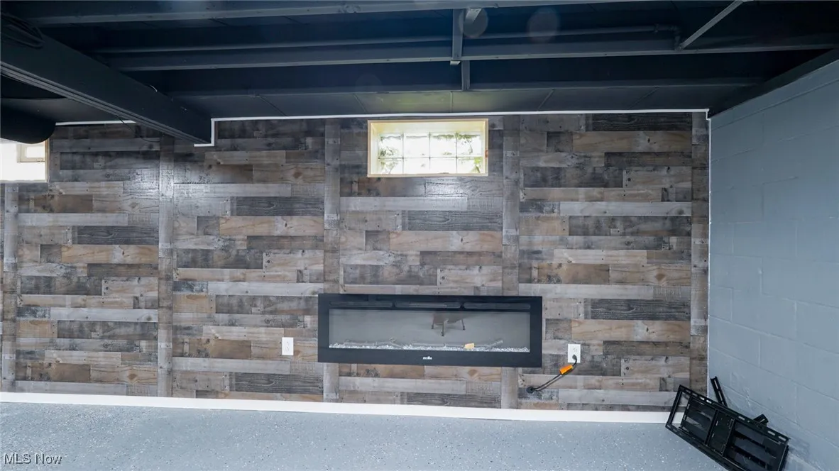 Detailed view of a fireplace and concrete block wall