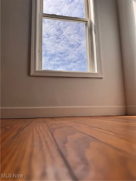 Spare room featuring healthy amount of natural light