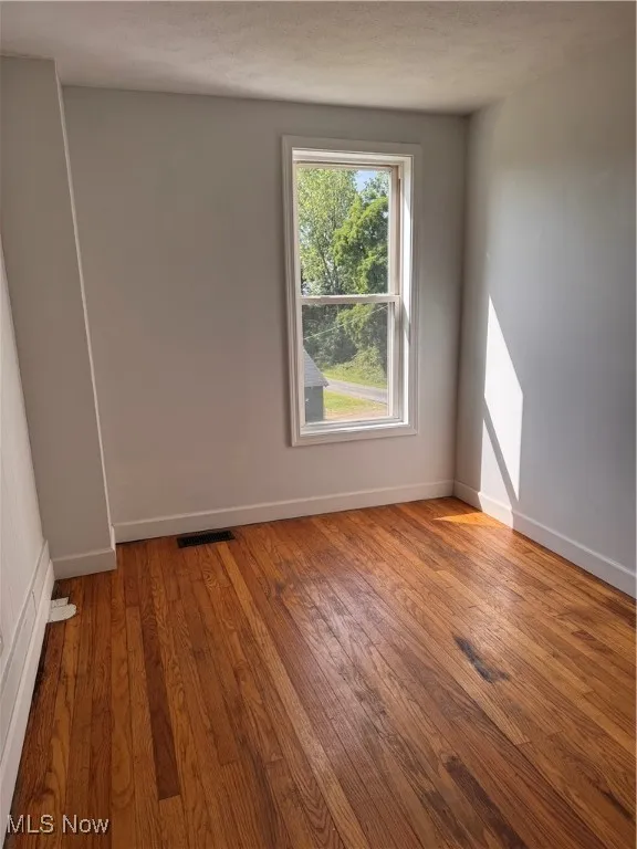 Empty room with wood finished floors