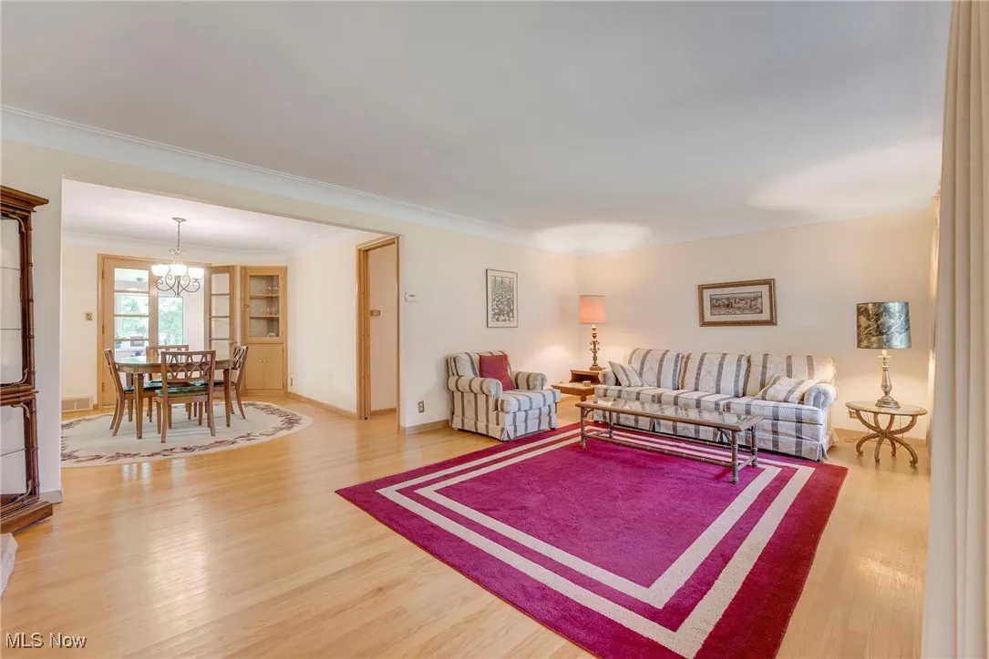 Living room opens to the formal dining room