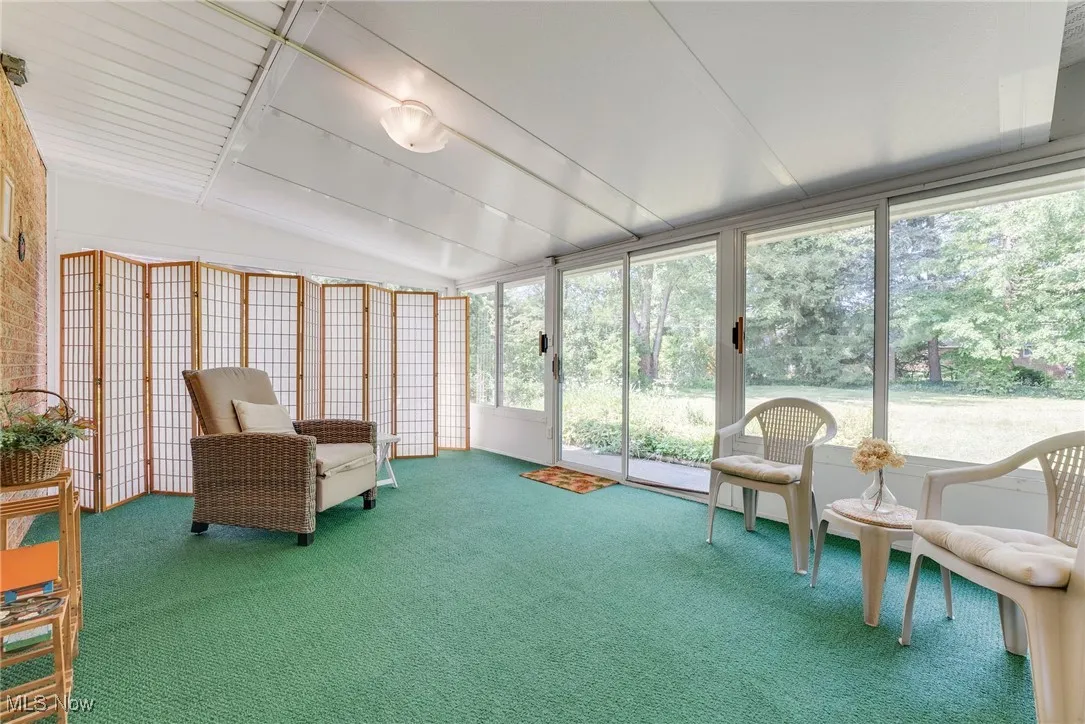 Large three-season glass room that overlooks the patio and private backyard