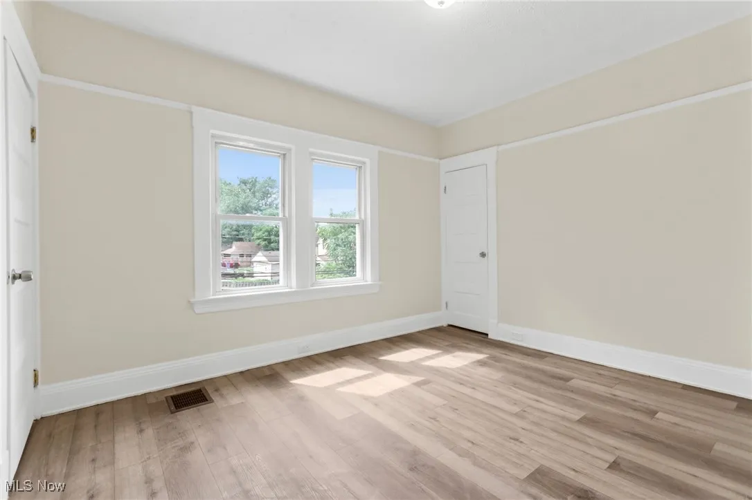 Empty room with light wood-type flooring