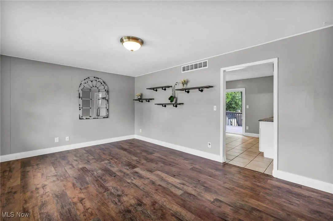 Empty room featuring wood finished floors