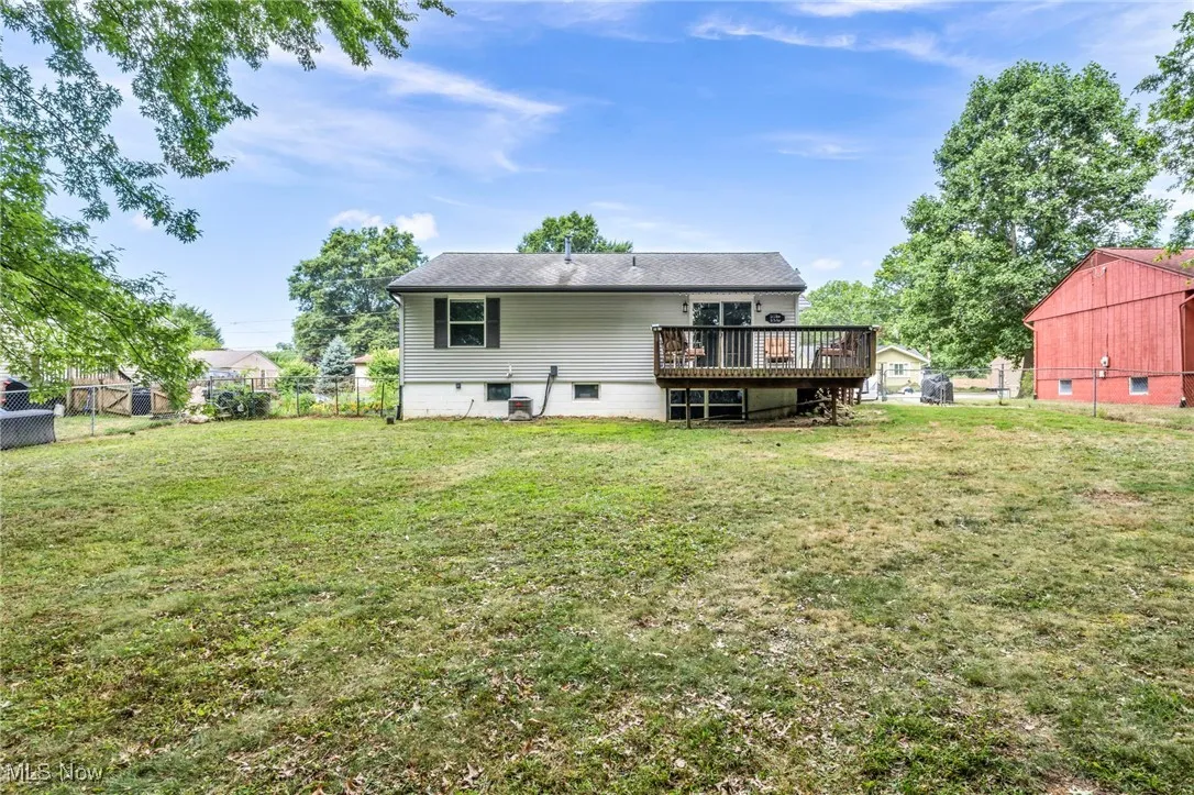 Rear view of house featuring a deck