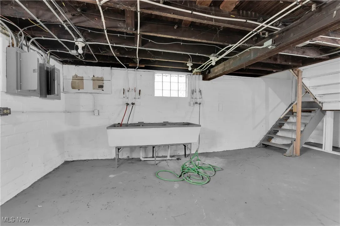 Basement featuring stairs