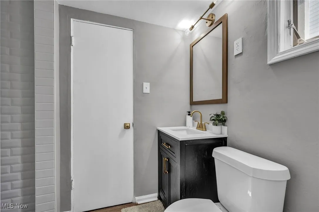 Bathroom featuring toilet and vanity