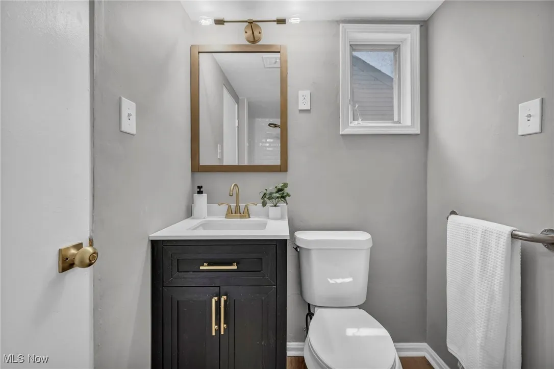 Bathroom with vanity and wood finished floors