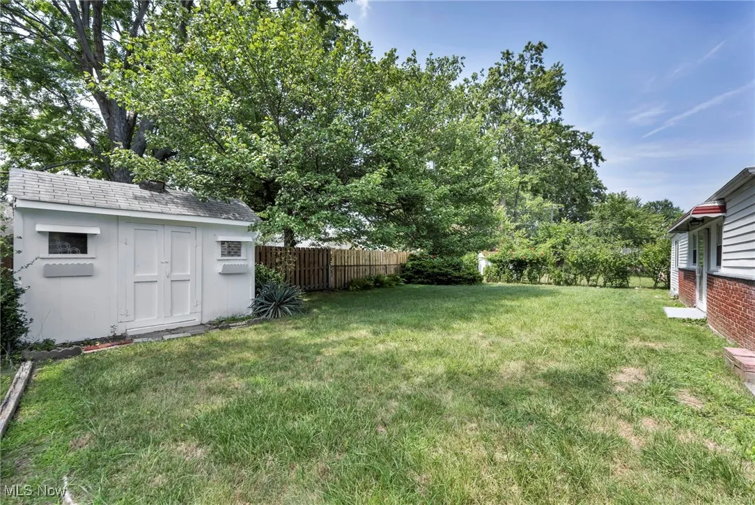 View of yard featuring a storage unit