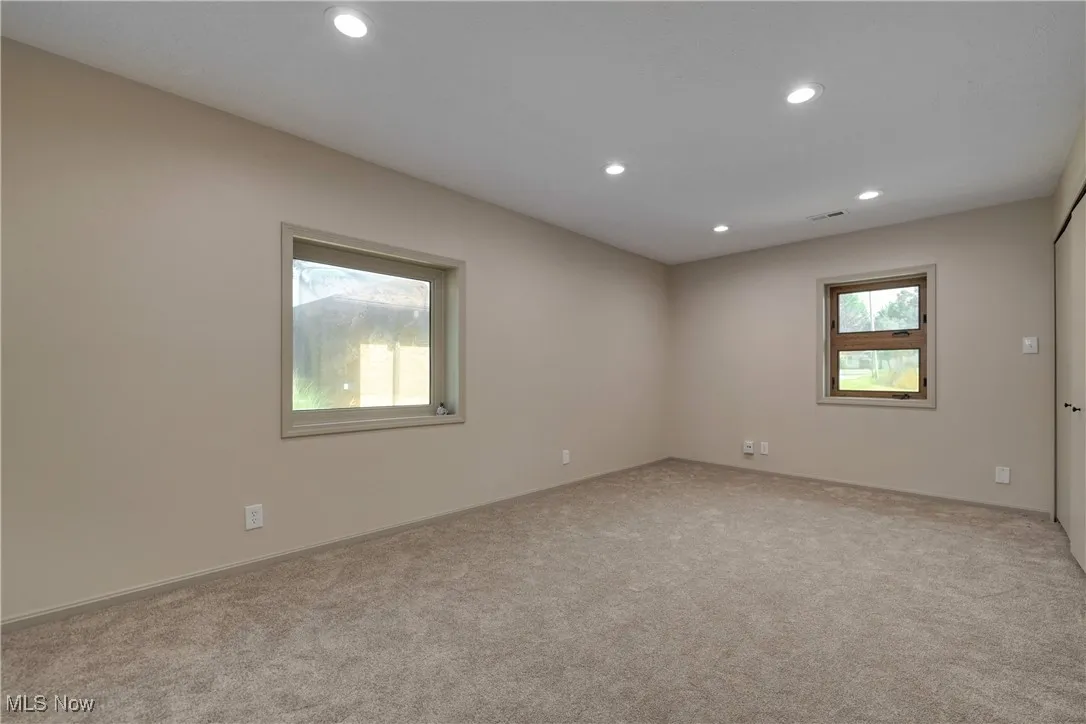 Empty room featuring recessed lighting and carpet floors