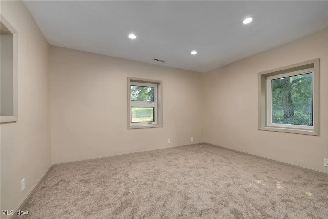 Unfurnished room with recessed lighting and carpet flooring