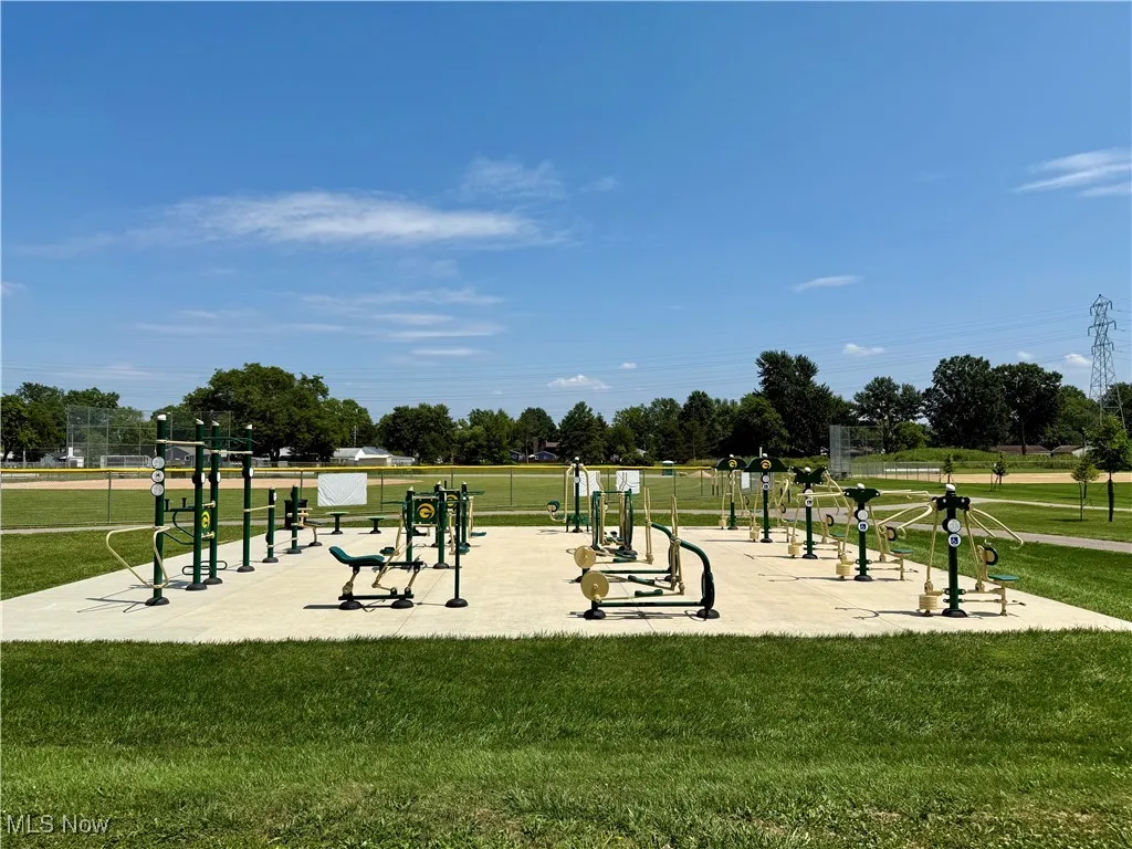 View of property's community featuring a lawn