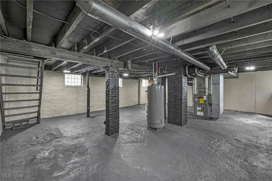 Below grade area with heating unit and gas water heater