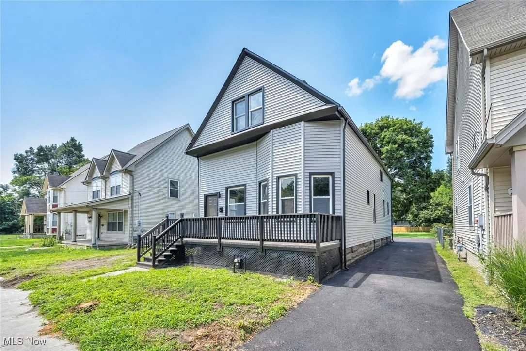 Rear view of house featuring a deck