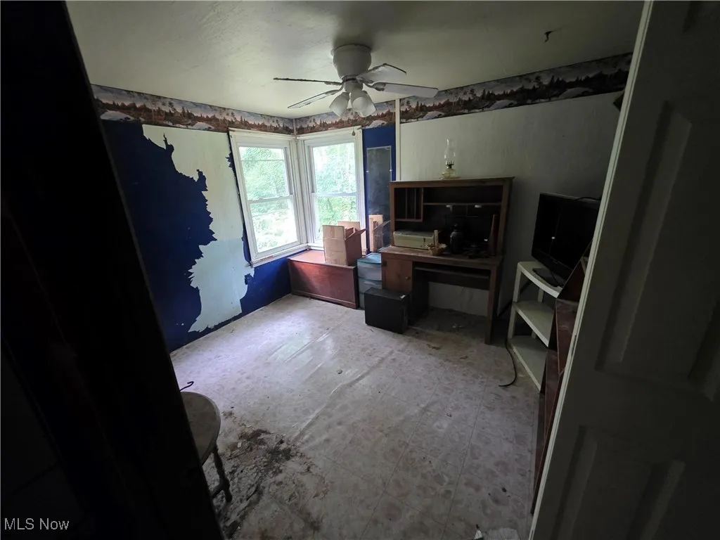 Home office featuring ceiling fan