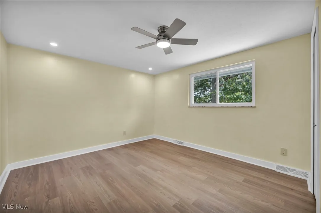 Unfurnished room with wood finished floors, recessed lighting, and ceiling fan