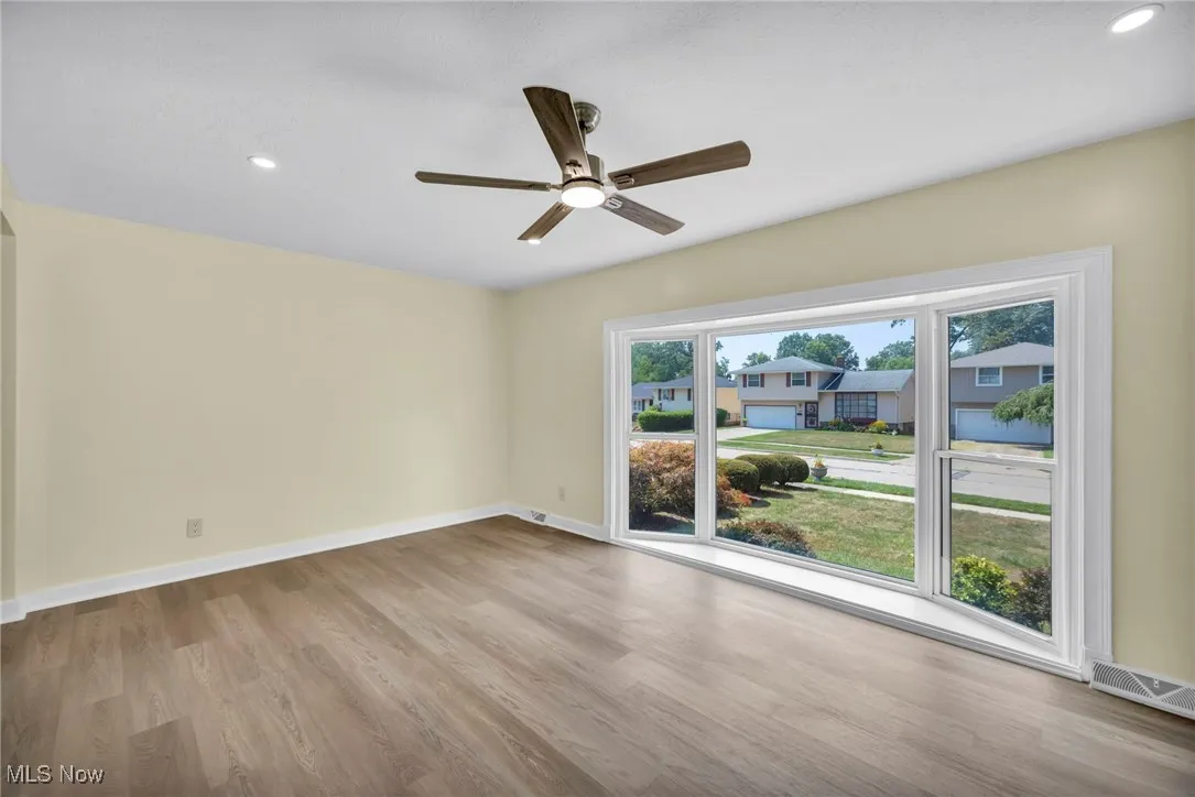 Spare room with recessed lighting, wood finished floors, and a ceiling fan