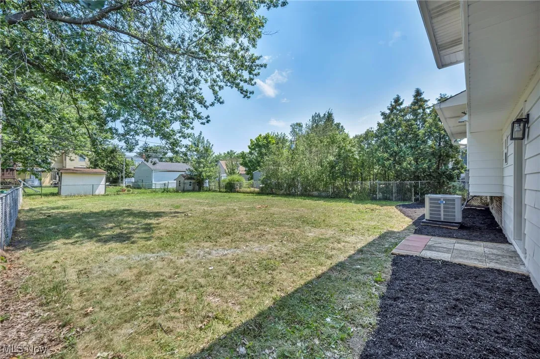 View of fenced backyard