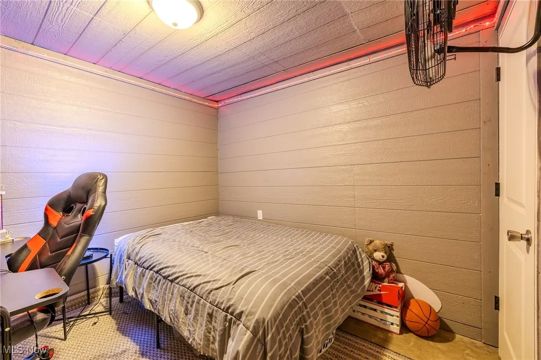 Bedroom with wooden walls