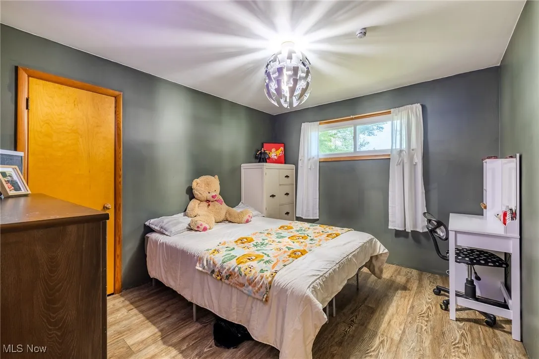 Bedroom with wood finished floors