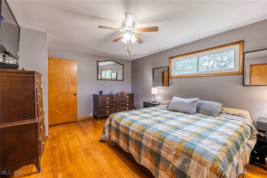 Bedroom featuring light wood finished floors and a ceiling fan