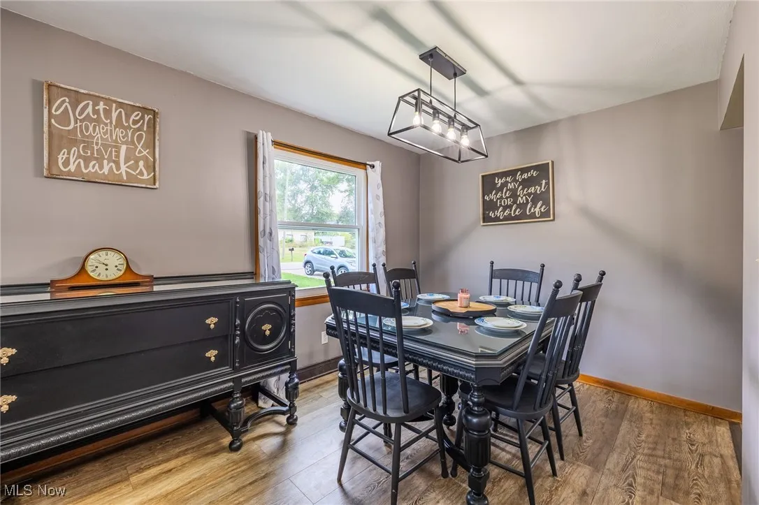 Dining room with wood finished floors and baseboards