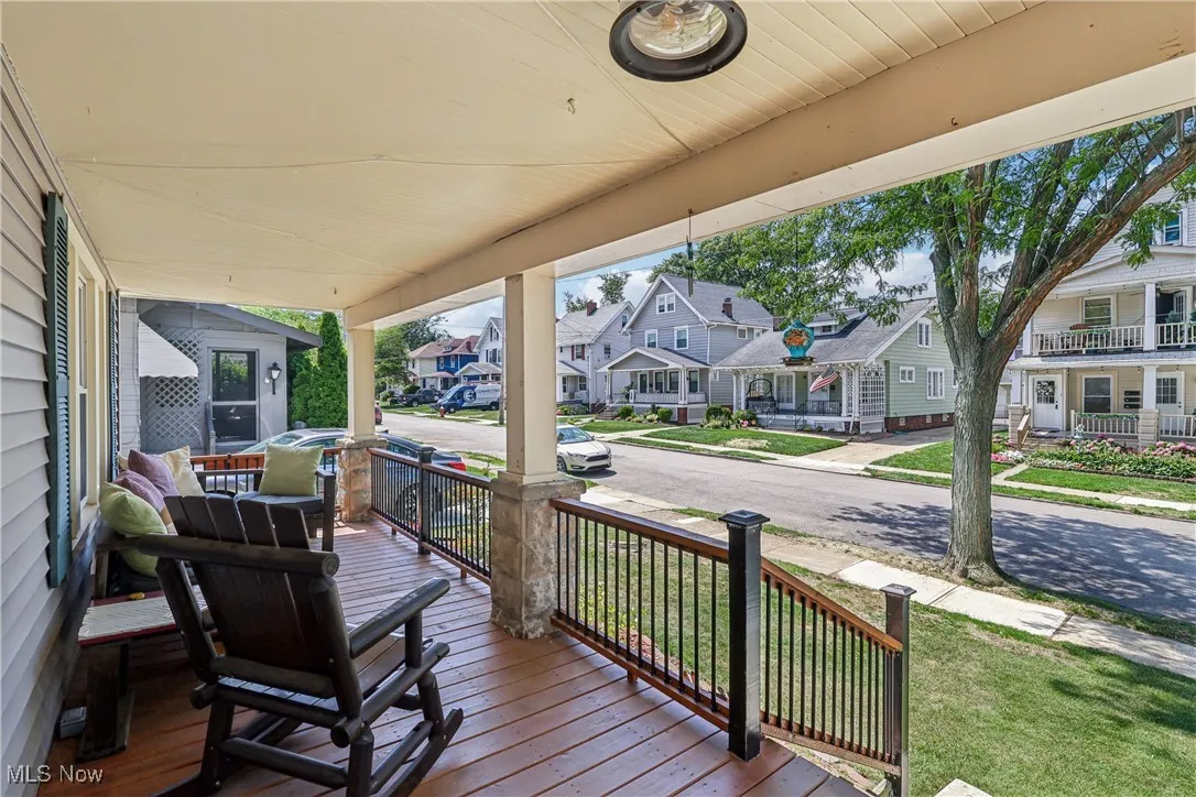 Wooden porch featuring a residential view