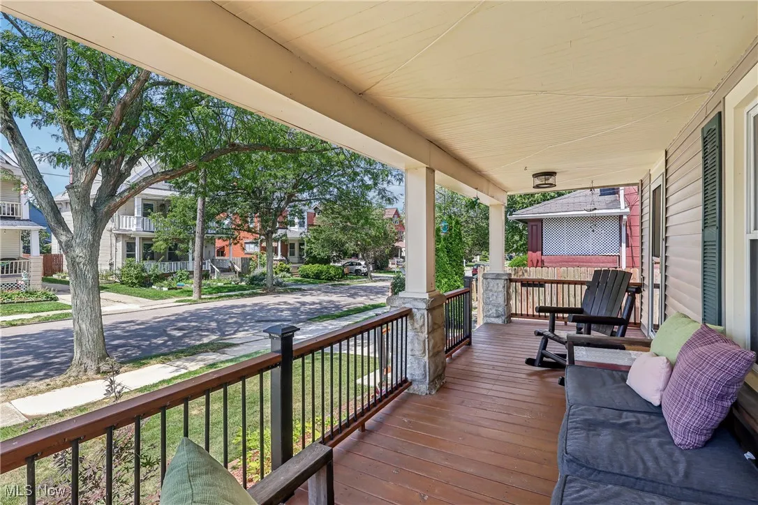Wooden porch featuring a residential view