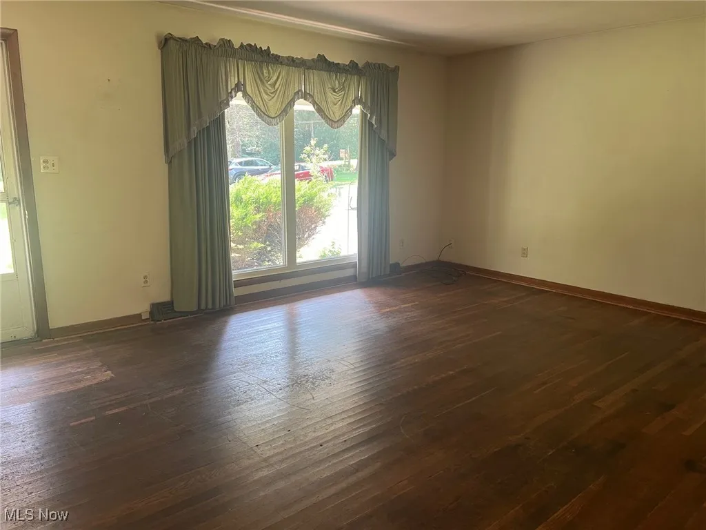 Living room featuring healthy amount of natural light and hardwood floors