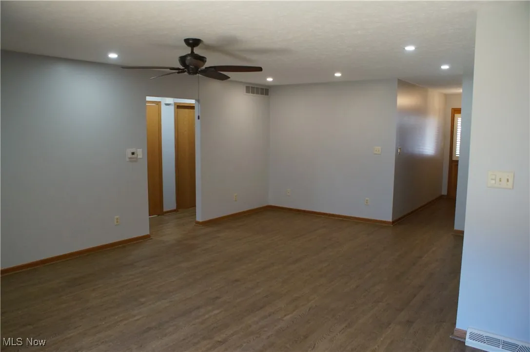 Unfurnished room with wood finished floors, recessed lighting, and a ceiling fan