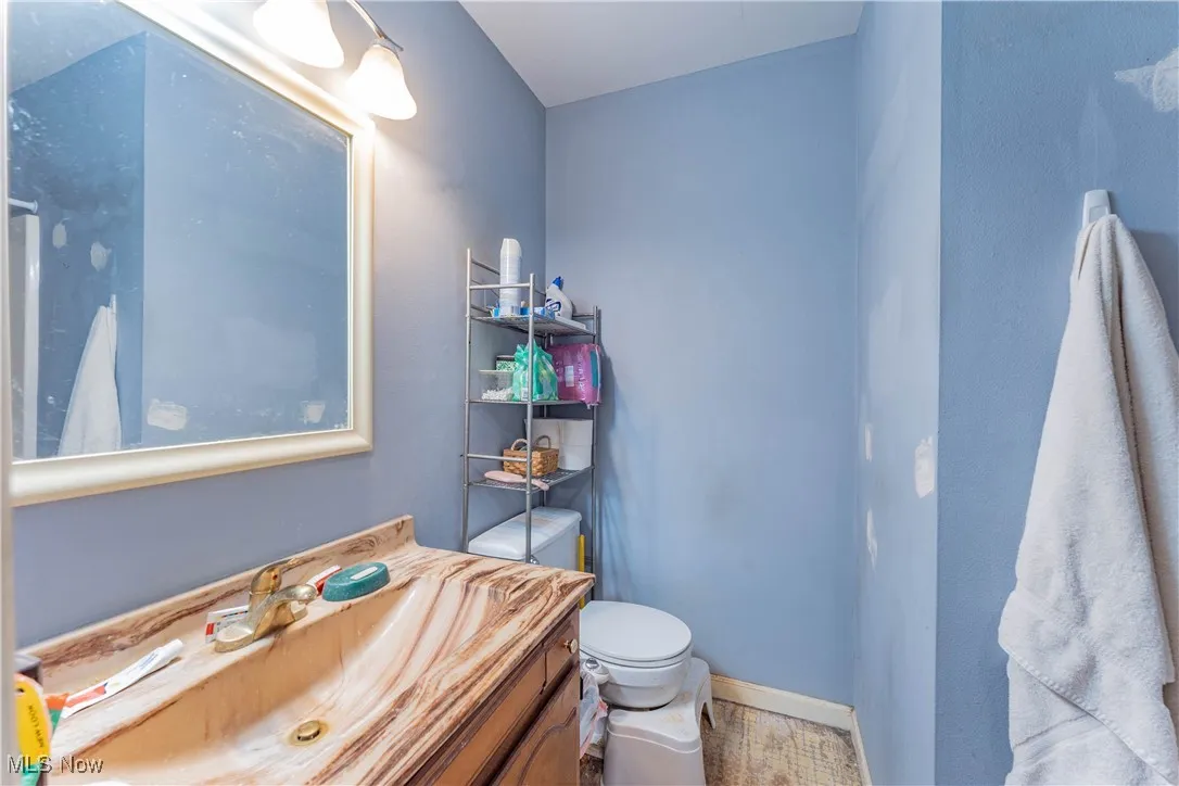 Bathroom with toilet and vanity