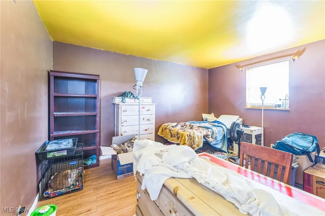 Bedroom with wood finished floors
