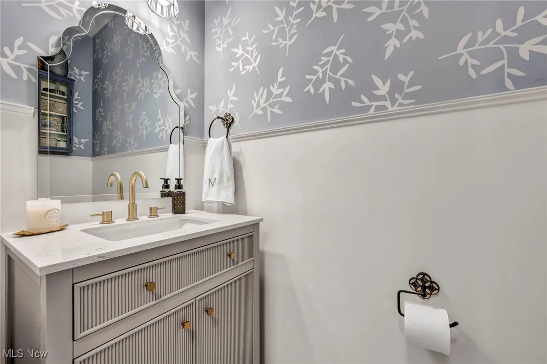 1/2 bath main featuring vanity