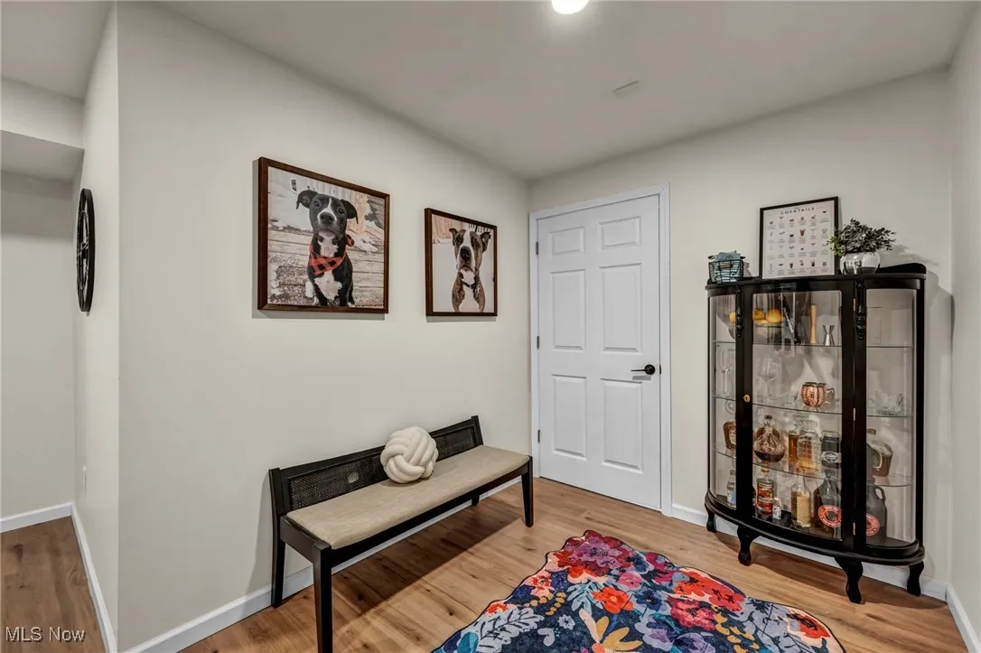  featuring wood finished floors and baseboards