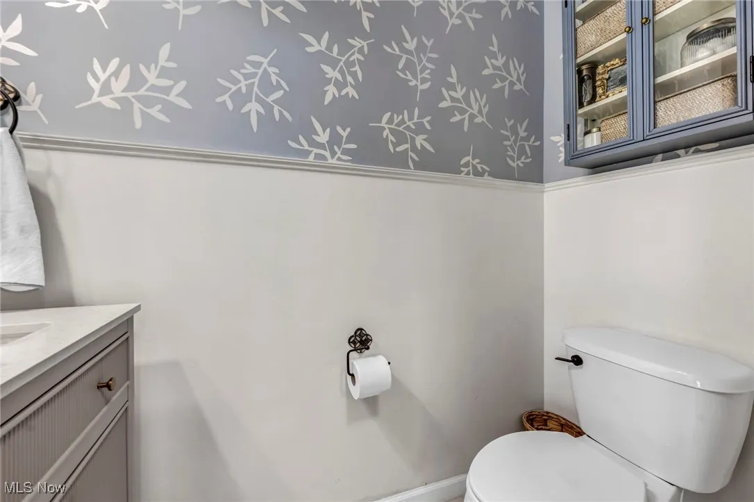 Half bath with vanity and toilet