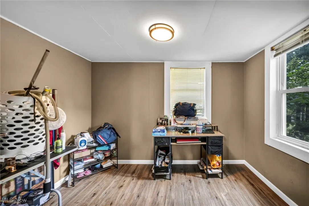 Office space with plenty of natural light and wood finished floors