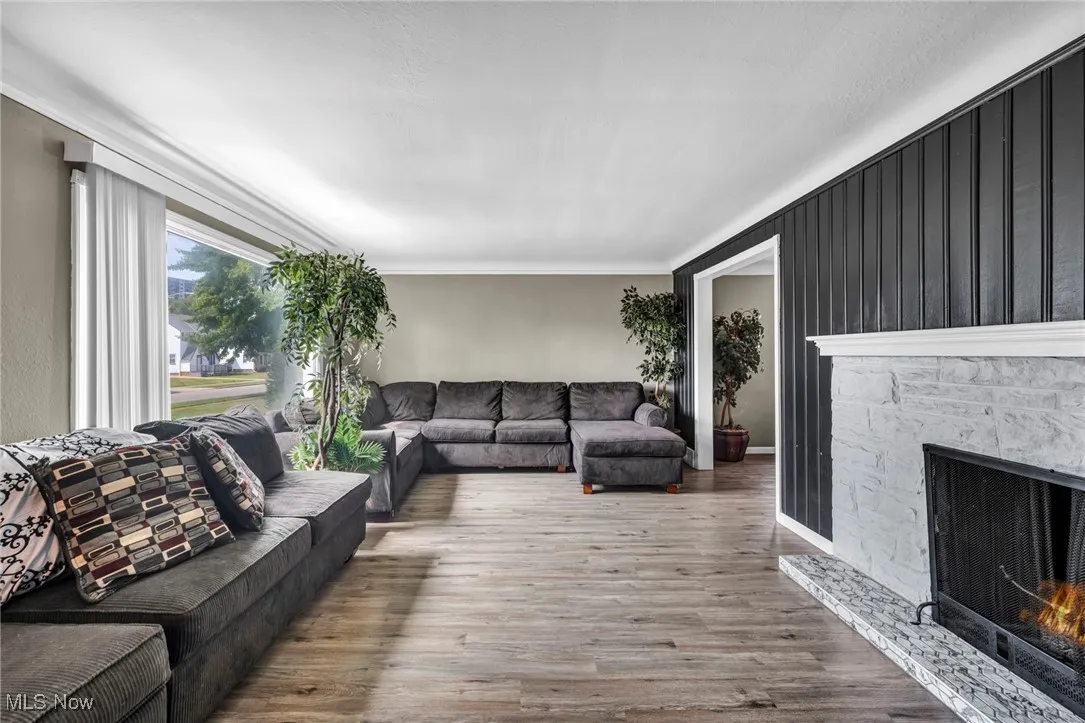 Living room featuring a fireplace and wood finished floors
