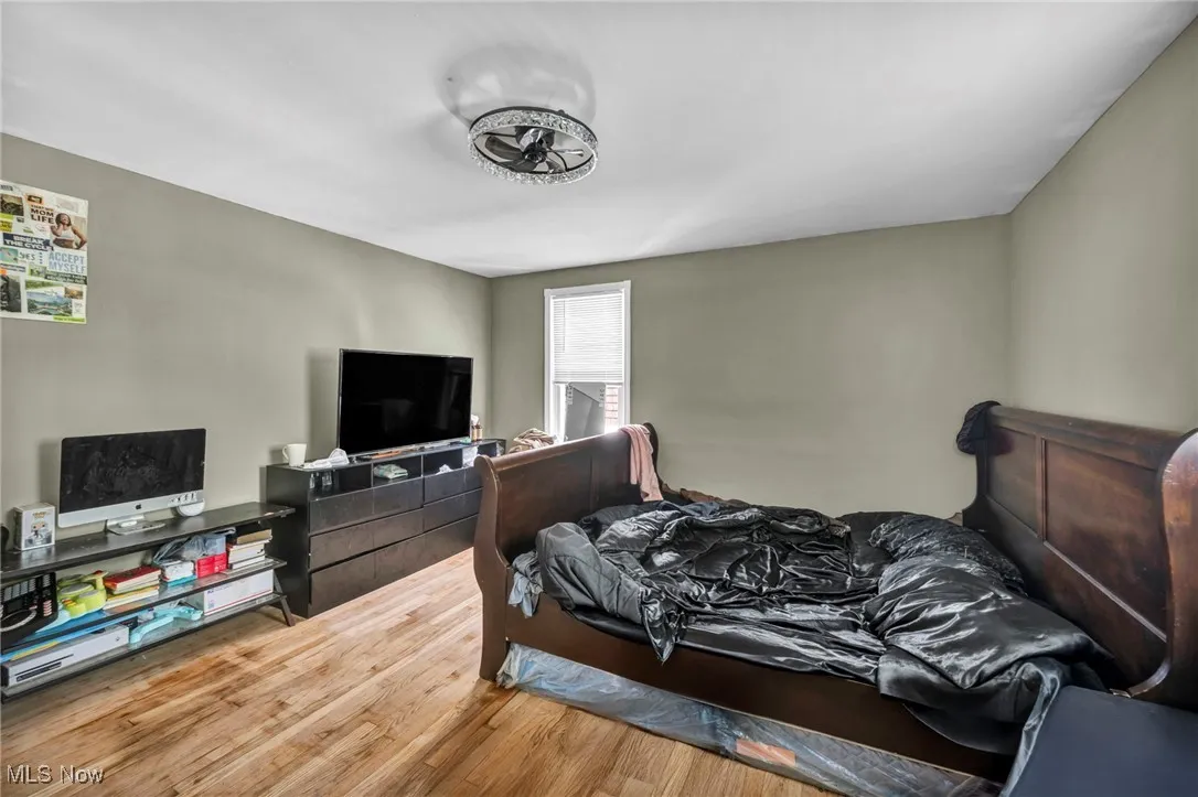 Bedroom with wood finished floors