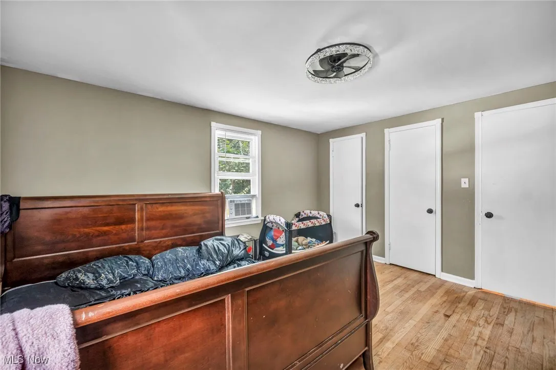 Bedroom featuring light wood-style flooring and baseboards