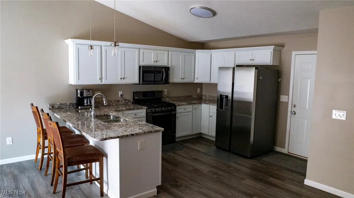 Clean spacious kitchen with Stainelss Steel appliances.