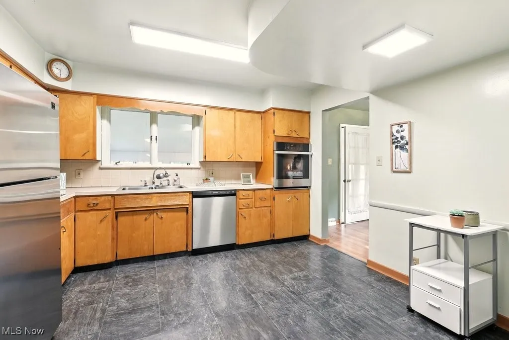 Kitchen with wood cabinetss