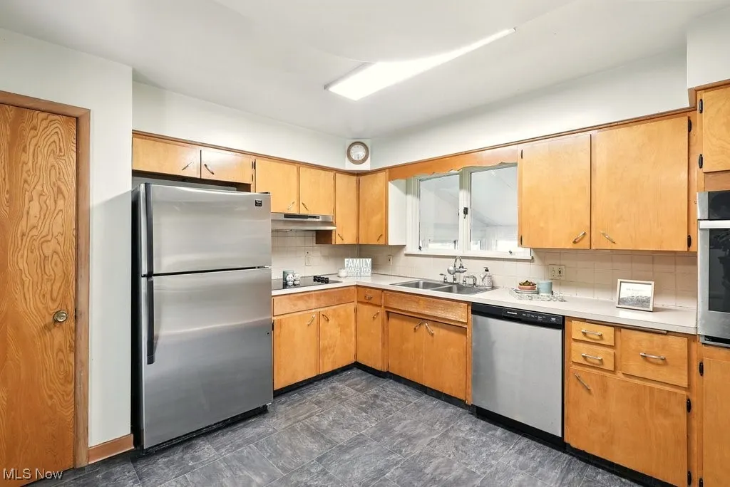 Kitchen with plenty of cabinet space and enough room for a table
