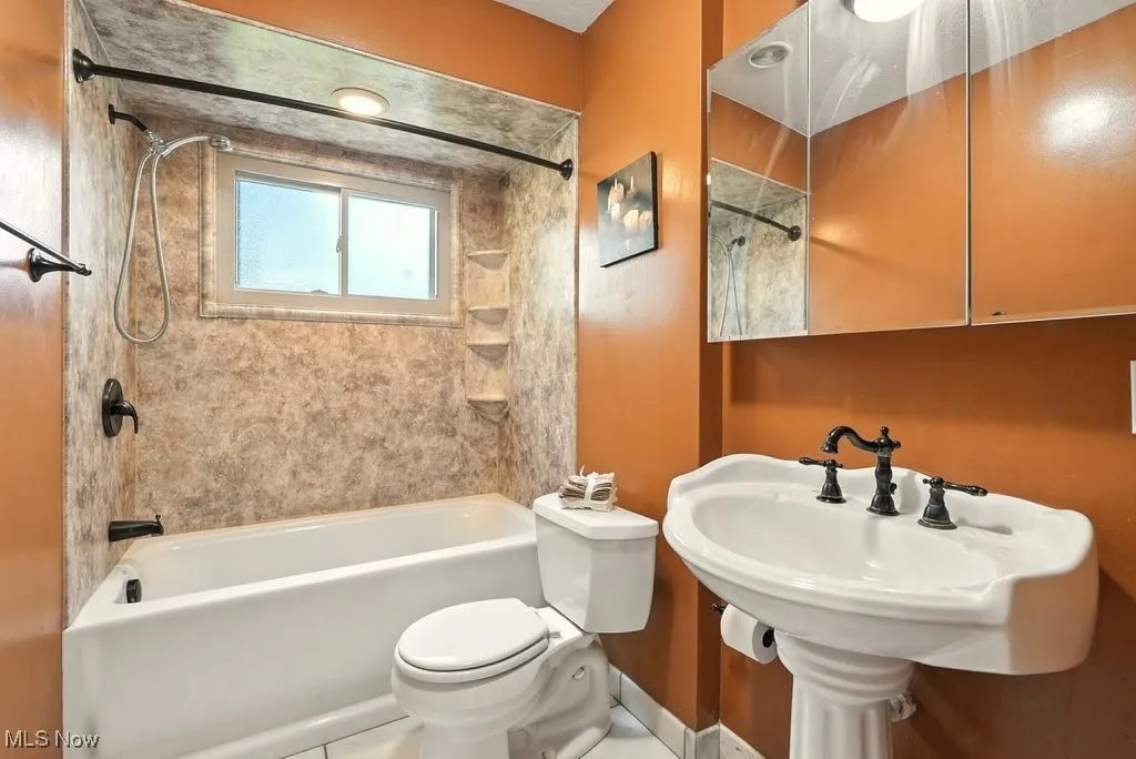 Full bathroom featuring  tub / shower combination and pedestal sink