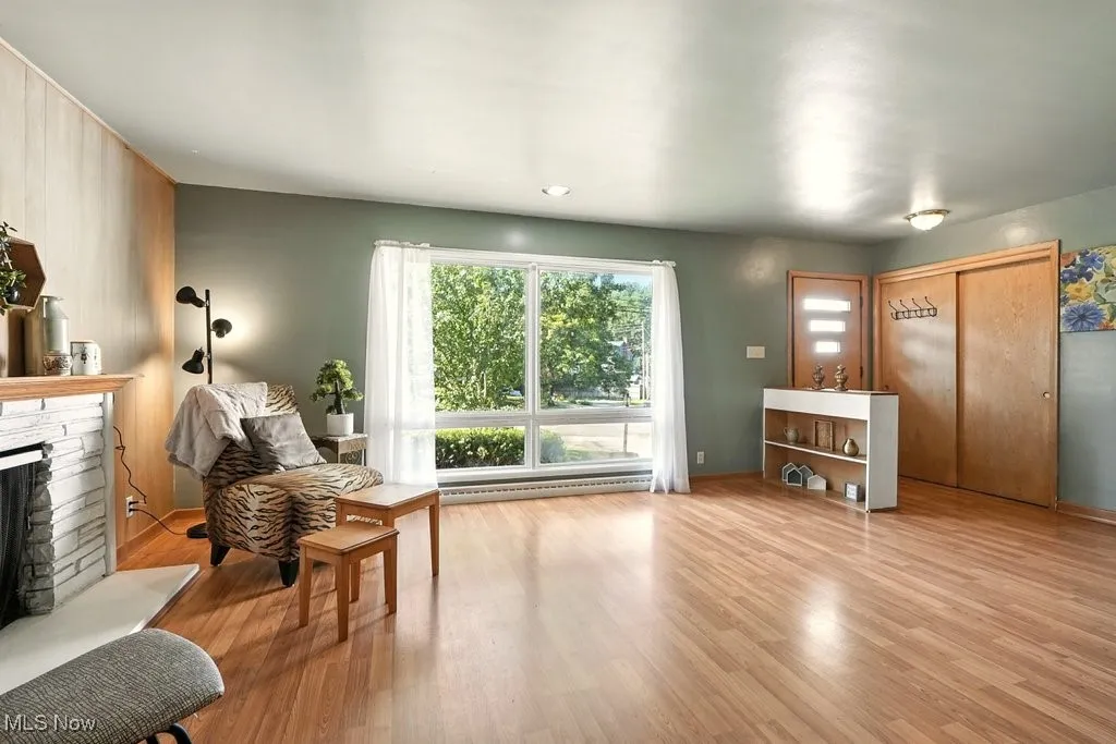 Living room has coat closet and two built-in bookcases