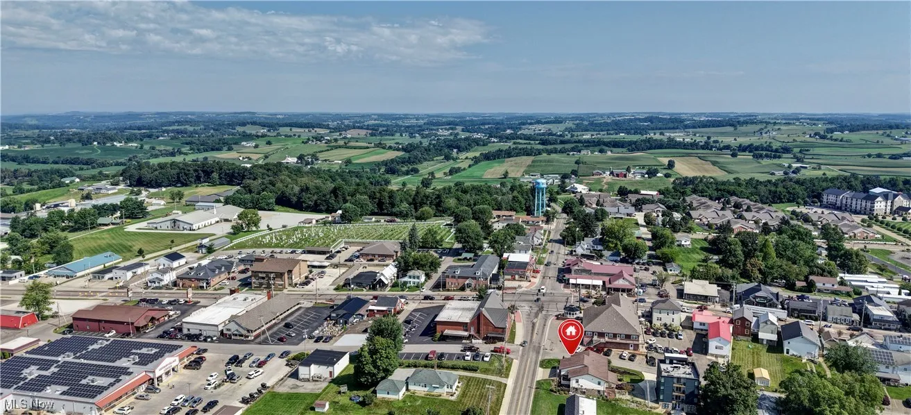 Aerial view of property's location featuring nearby suburban area
