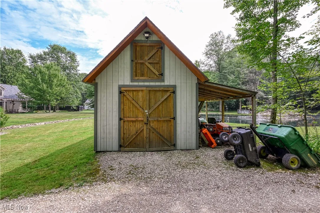 View of outdoor structure featuring a carport