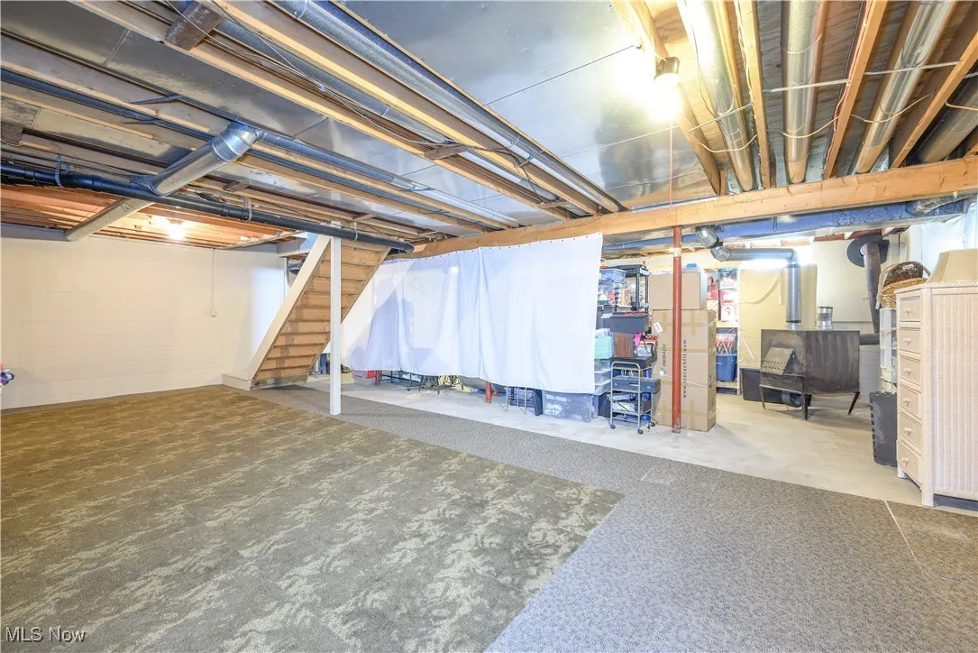 Unfinished basement with stairway