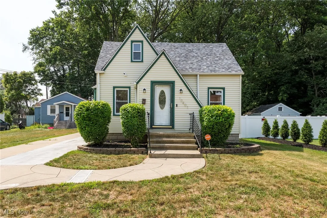 View of front of home featuring a shingled roof and entry steps