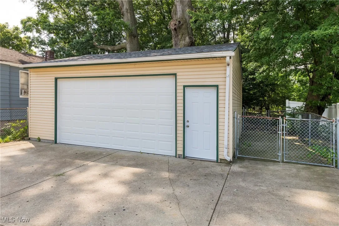 Detached garage featuring a gate