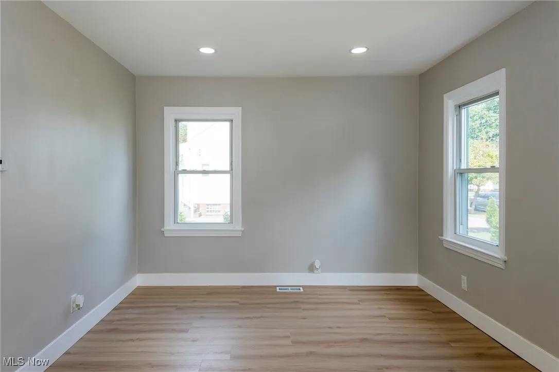 Spare room with light wood-style flooring and recessed lighting